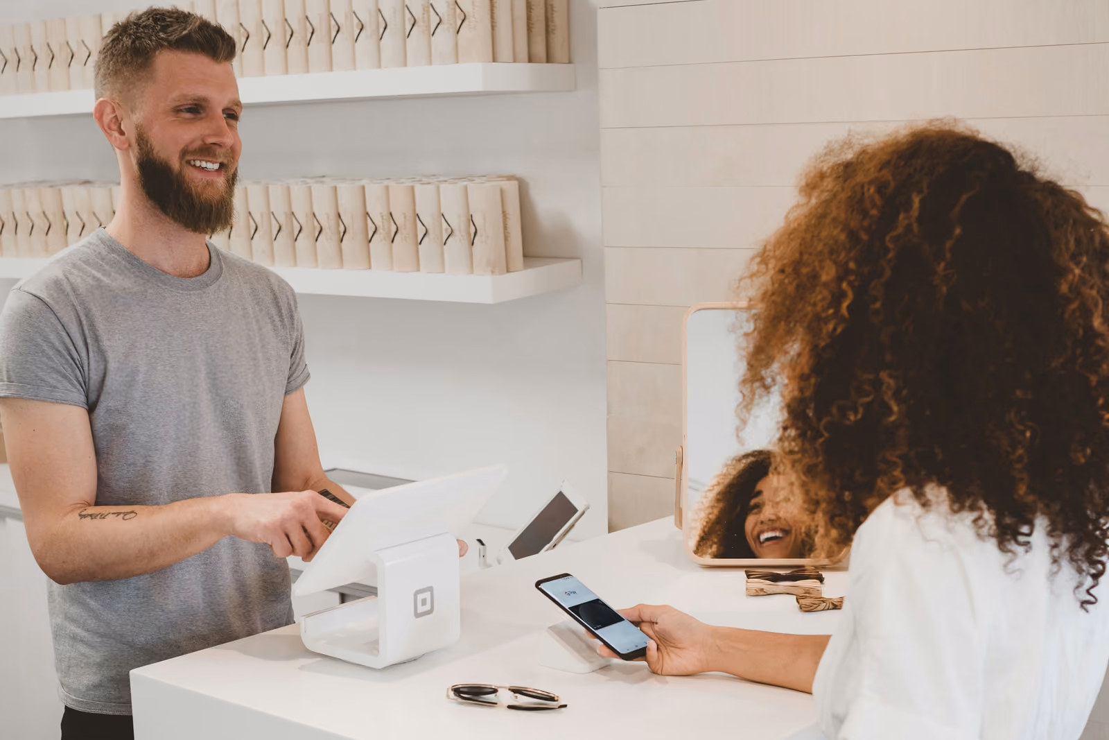 Traveler making a contactless payment with a phone